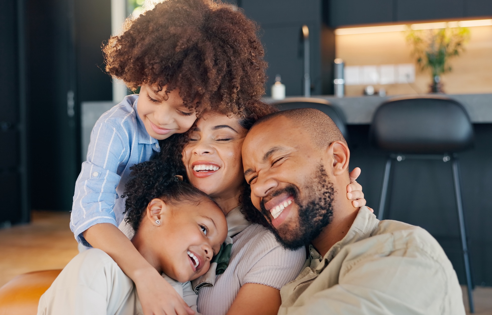 Family, children and happy hug for love with bonding together, healthy relationship and trust in home. Mother, father and kids with cheerful embrace for care, wellness support and relax with cuddle